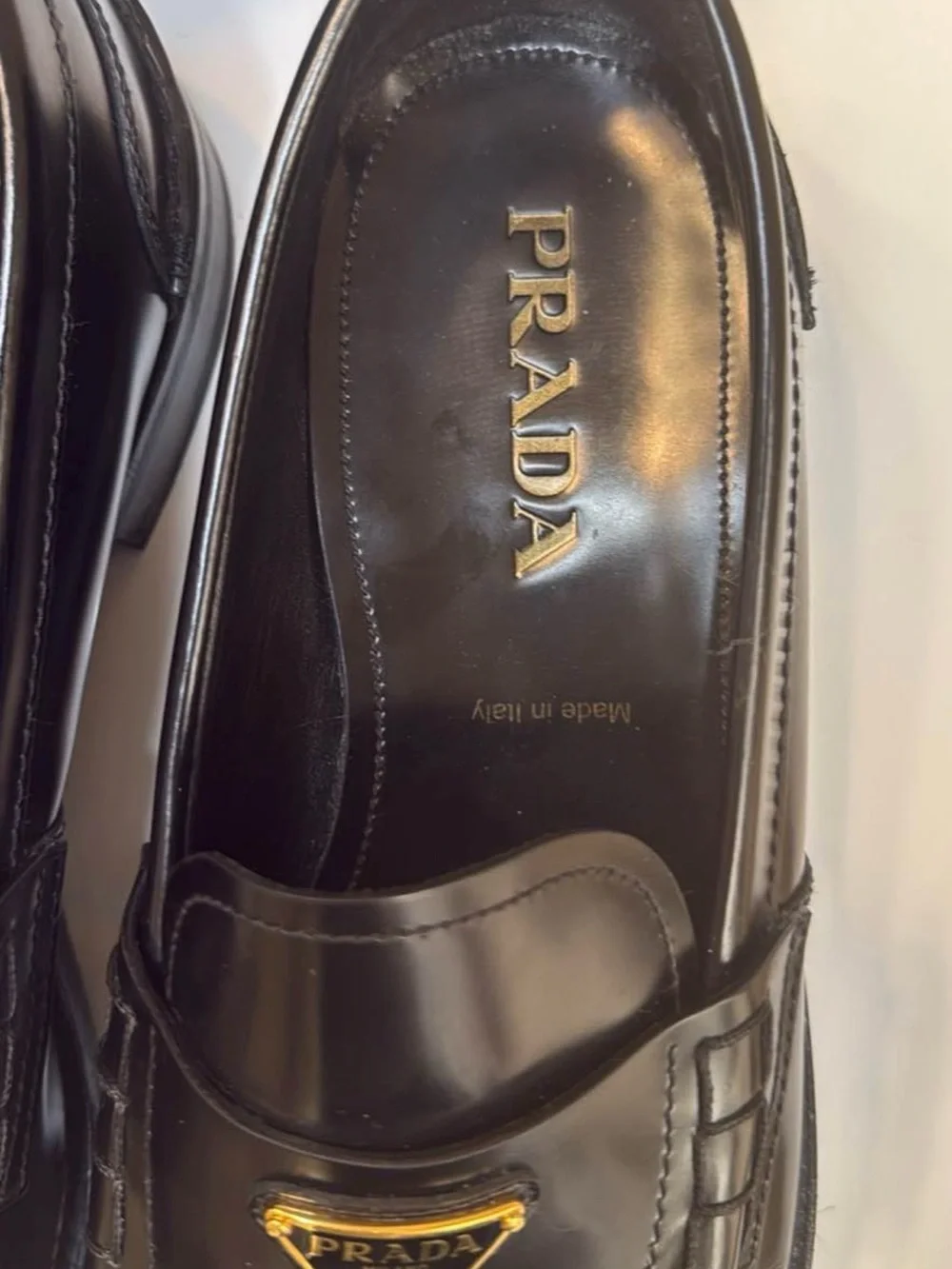 Prada Black Leather Men's Slip-On Loafers with Gold Logo